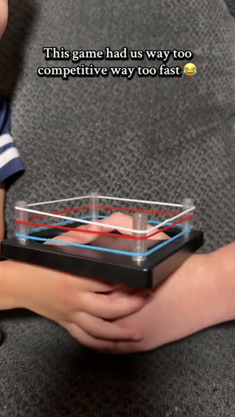 Thumb wrestling ring game